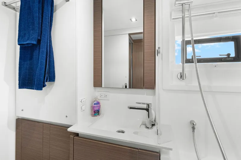 Slide: The Image of Modern bathroom interior of 2024 Leopard 46 Powercat yacht with sleek fixtures and blue towels. - 66