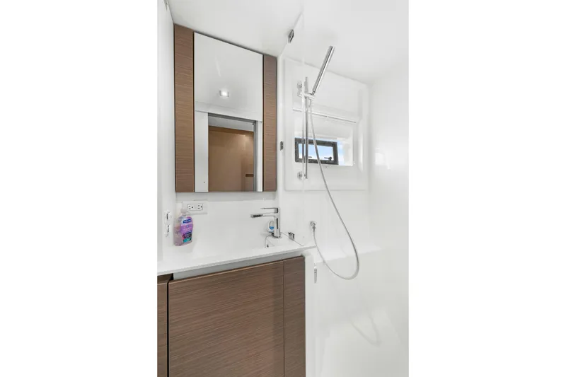 Slide: The Image of Modern bathroom in 2024 Leopard 46 Powercat yacht with sleek fixtures and wood accents. - 69