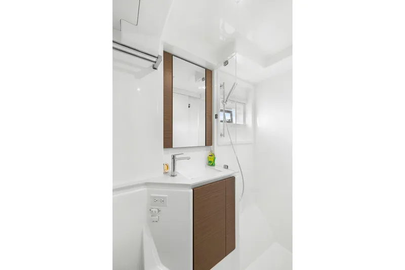 Slide: The Image of Modern bathroom in 2024 Leopard 46 Powercat yacht with sleek fixtures and wood accents. - 71