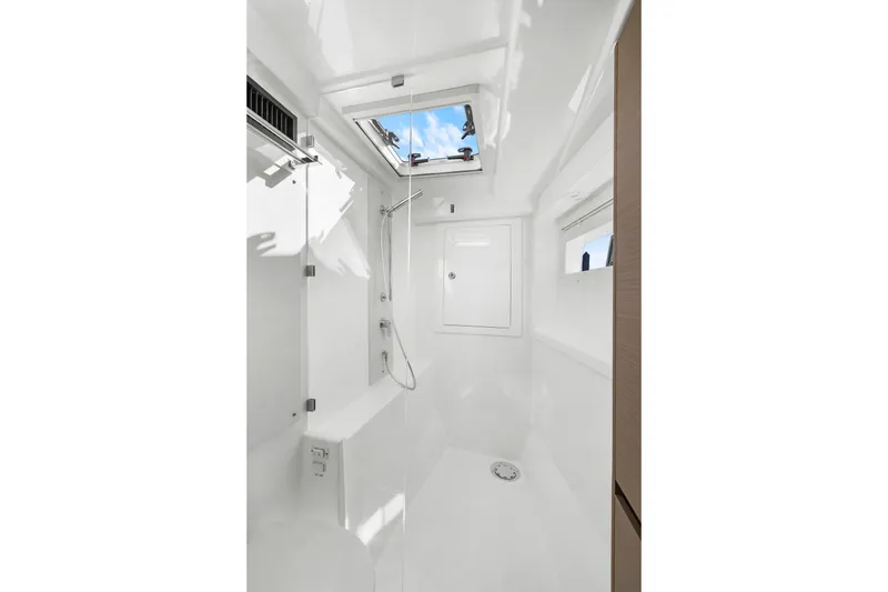 Slide: The Image of 2024 Leopard 46 Powercat shower area with skylight and modern fixtures. - 72