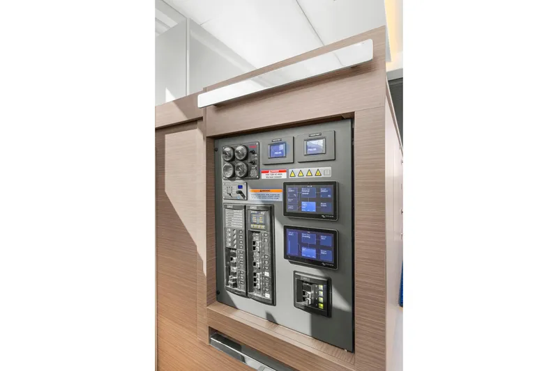 Slide: The Image of Electrical control panel on 2024 Leopard 46 Powercat yacht, featuring modern digital displays. - 74