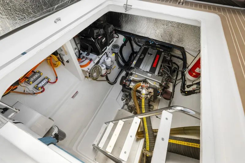 Slide: The Image of Engine compartment of 2024 Leopard 46 Powercat, featuring Yamaha engine and electrical components. - 77