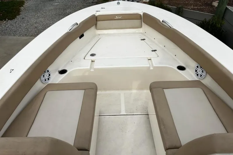 Slide: The Image of 2022 Scout 195 Sport Dorado boat interior with beige seating and white deck. - 10