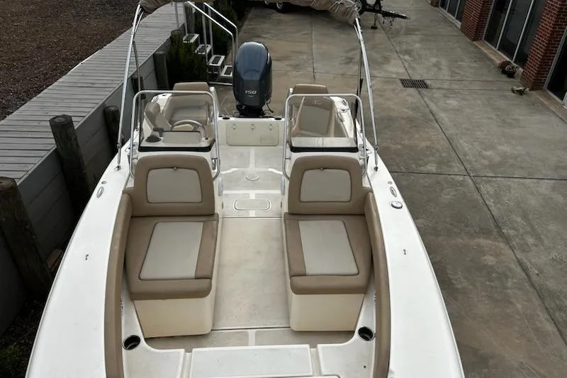 Slide: The Image of 2022 Scout 195 Sport Dorado boat with beige seating and Yamaha outboard motor. - 11