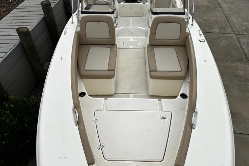 Slide: The Image of 2022 Scout 195 Sport Dorado boat interior with beige seating and white deck. - 12
