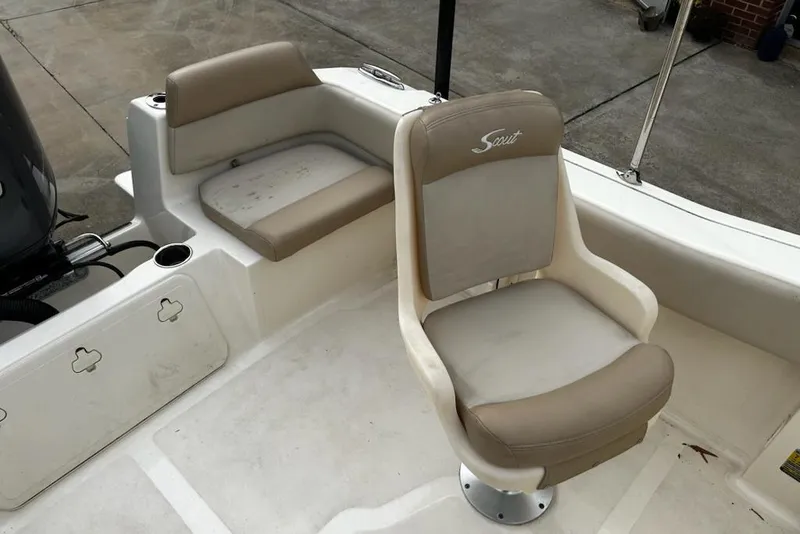 Slide: The Image of 2022 Scout 195 Sport Dorado boat interior with beige seating and cup holder. - 14