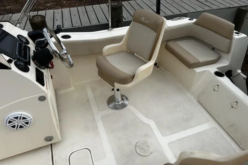 Slide: The Image of 2022 Scout 195 Sport Dorado boat interior with seating and steering console. - 15