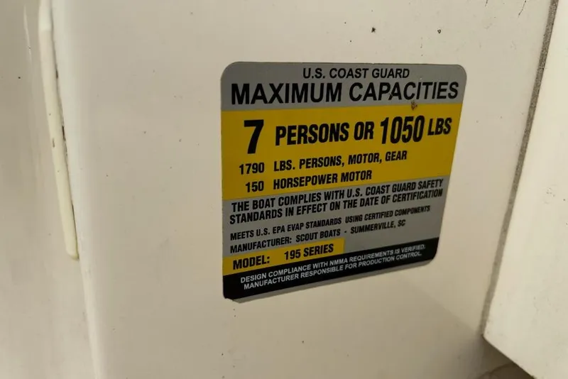 Slide: The Image of U.S. Coast Guard capacity label for 2022 Scout 195 Sport Dorado boat, 7 persons or 1050 lbs. - 16