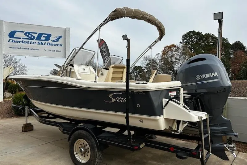 Slide: The Image of 2022 Scout 195 Sport Dorado boat on trailer at Charlotte Ski Boats dealership. - 5
