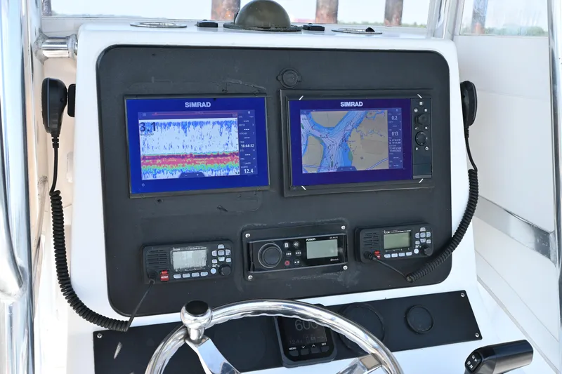 Slide: The Image of Control panel of a 1983 SeaVee 260B boat with Simrad navigation displays. - 8