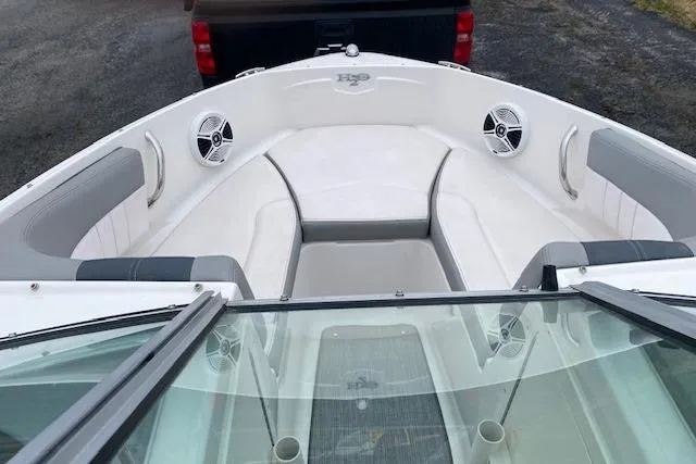 Slide: The Image of 2019 Chaparral 19 H2O Sport boat interior with seating and speakers. - 3