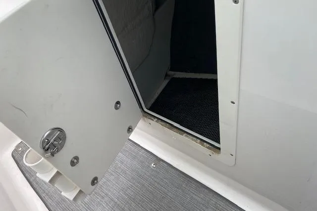 Slide: The Image of Open storage compartment on 2019 Chaparral 19 H2O Sport boat. - 5