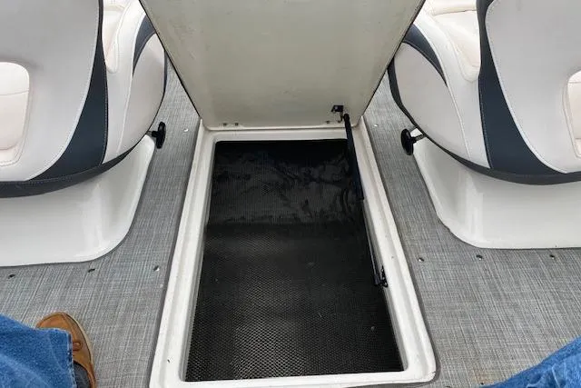 Slide: The Image of Open storage compartment on 2019 Chaparral 19 H2O Sport boat interior. - 7
