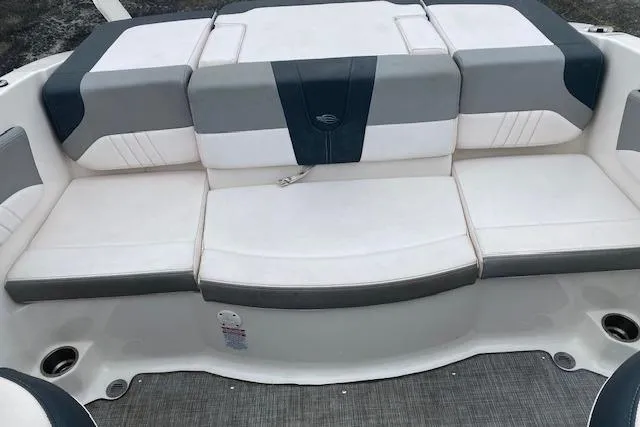 Slide: The Image of 2019 Chaparral 19 H2O Sport boat interior with cushioned seating. - 8