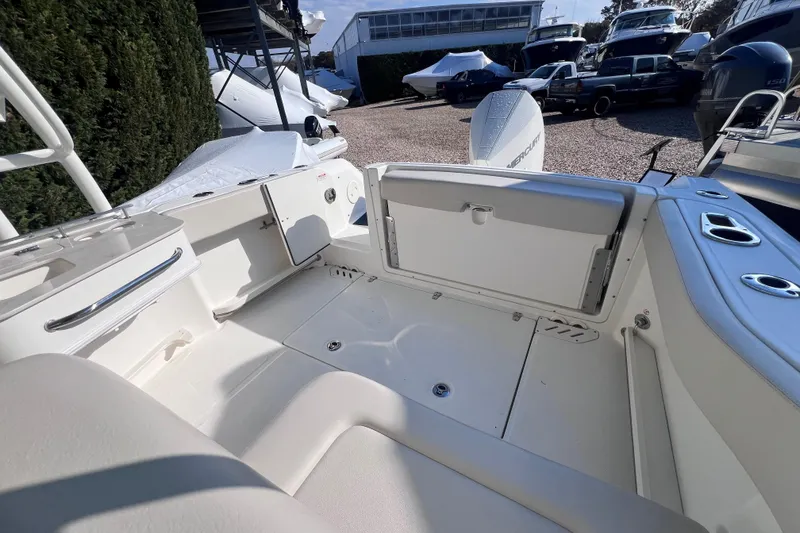 Slide: The Image of 2020 Boston Whaler 230 Vantage boat interior with seating and storage compartments. - 10