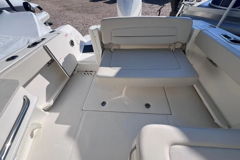 Slide: The Image of 2020 Boston Whaler 230 Vantage boat interior with seating and storage compartments. - 13