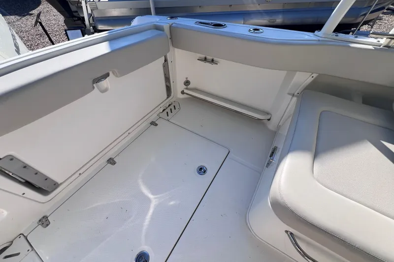 Slide: The Image of 2020 Boston Whaler 230 Vantage boat interior with seating and storage compartments. - 14