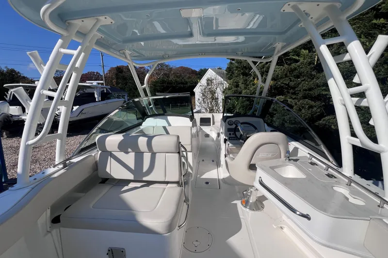 Slide: The Image of 2020 Boston Whaler 230 Vantage boat interior with seating and helm station. - 16