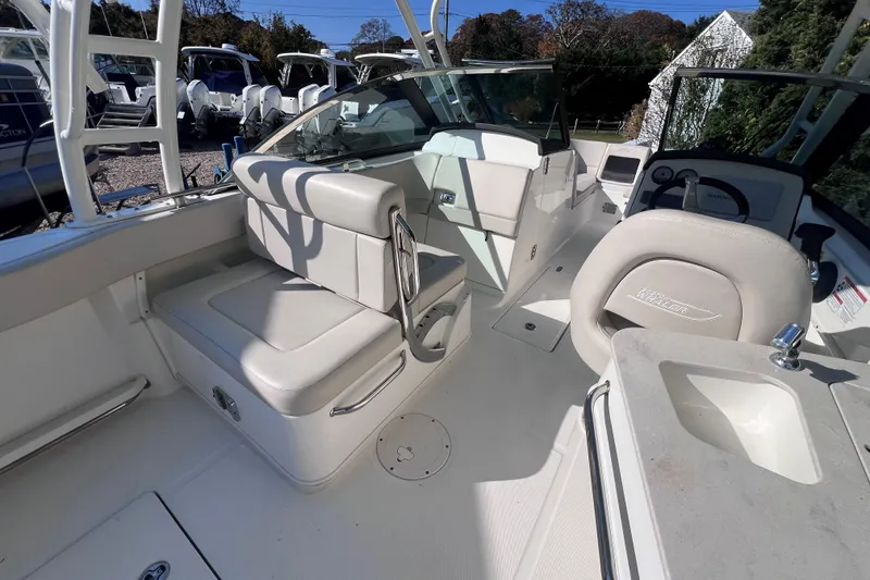 Slide: The Image of 2020 Boston Whaler 230 Vantage boat interior with seating and helm. - 17