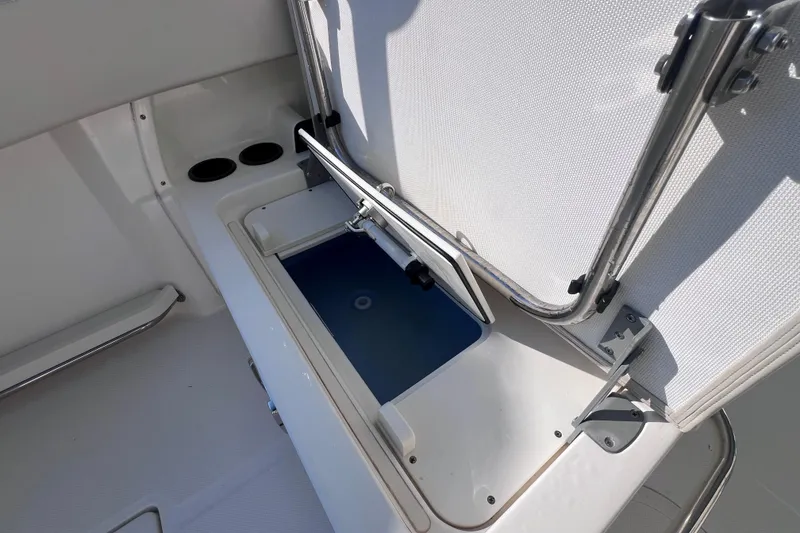 Slide: The Image of Open storage compartment on a 2020 Boston Whaler 230 Vantage boat. - 18