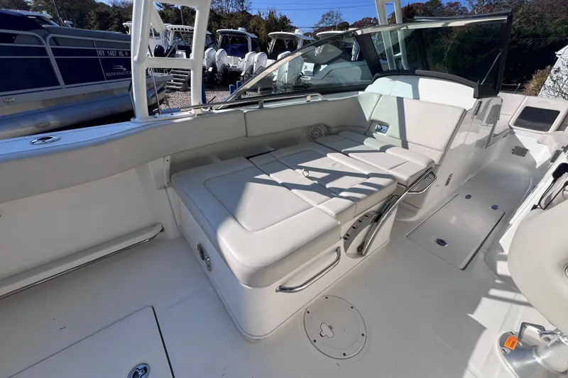 Slide: The Image of 2020 Boston Whaler 230 Vantage boat interior with white seating and sleek design. - 19