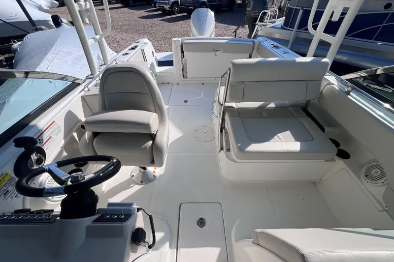 Slide: The Image of 2020 Boston Whaler 230 Vantage boat interior with seating and steering wheel. - 20
