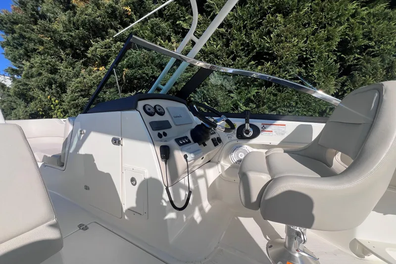 Slide: The Image of 2020 Boston Whaler 230 Vantage boat cockpit with steering wheel and controls. - 22
