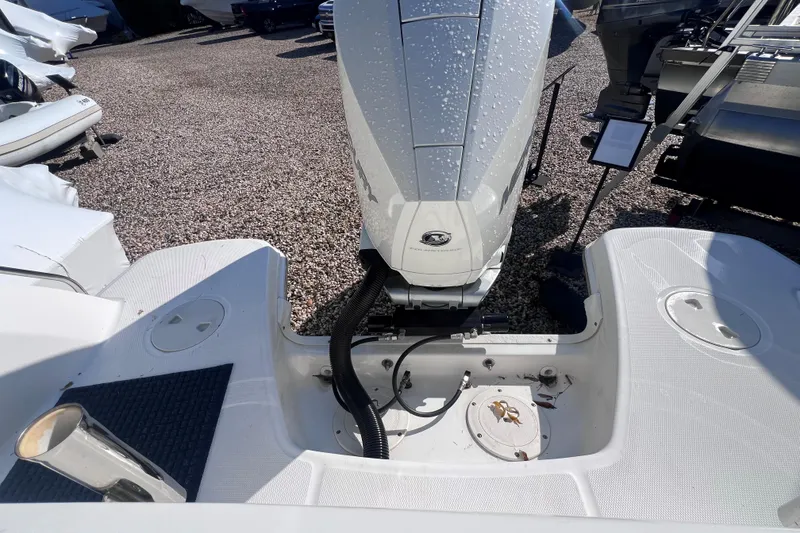Slide: The Image of 2020 Boston Whaler 230 Vantage boat engine area with water droplets. - 9