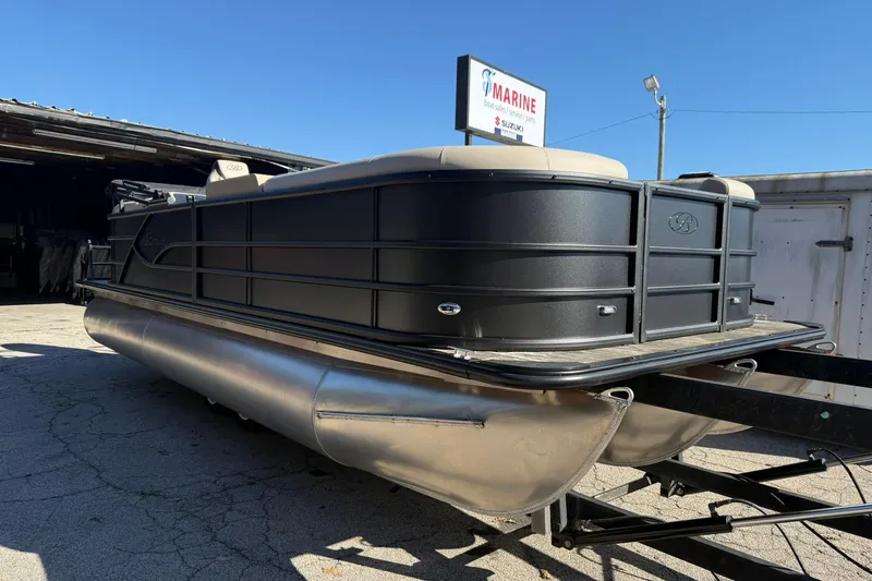 The Image of 2026 Bentley Pontoons Legacy 223 Navigator on trailer, parked outdoors. - 0