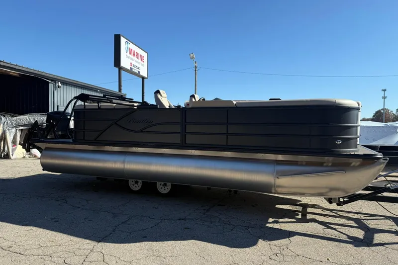 Slide: The Image of 2026 Bentley Pontoons Legacy 223 Navigator, sleek design, parked outdoors under clear sky. - 1