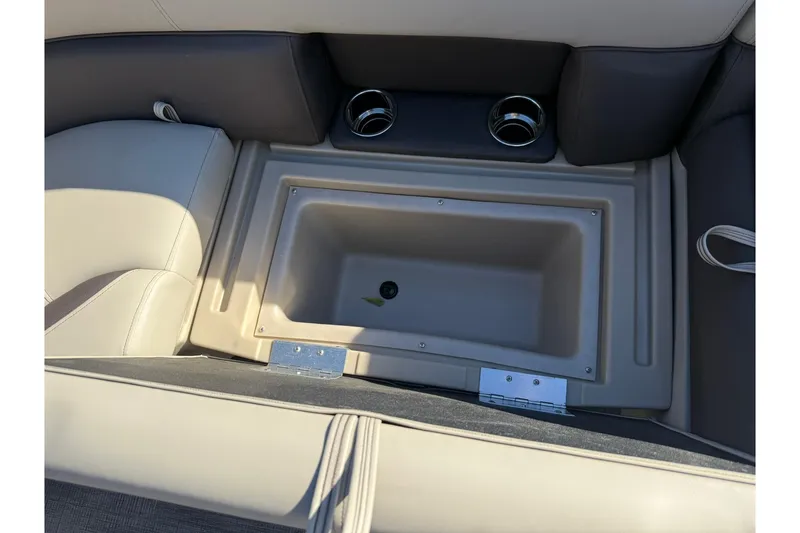 Slide: The Image of 2026 Bentley Pontoons Legacy 223 Navigator interior storage compartment with cup holders. - 13