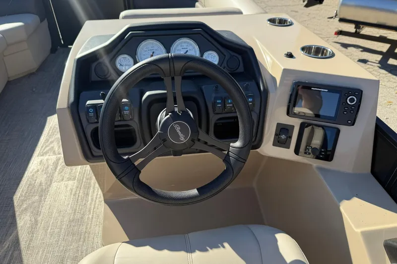 Slide: The Image of 2026 Bentley Pontoons Legacy 223 Navigator dashboard with steering wheel and controls. - 9