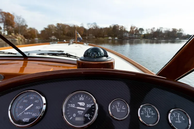 Slide: The Image of Dashboard view of 2006 Hinckley Talaria 29 R boat with gauges and compass. - 32