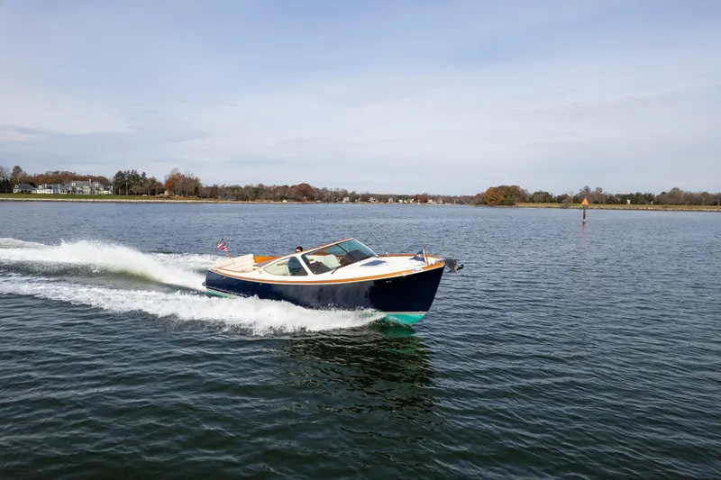 Slide: The Image of 2006 Hinckley Talaria 29 R cruising on a calm lake. - 4