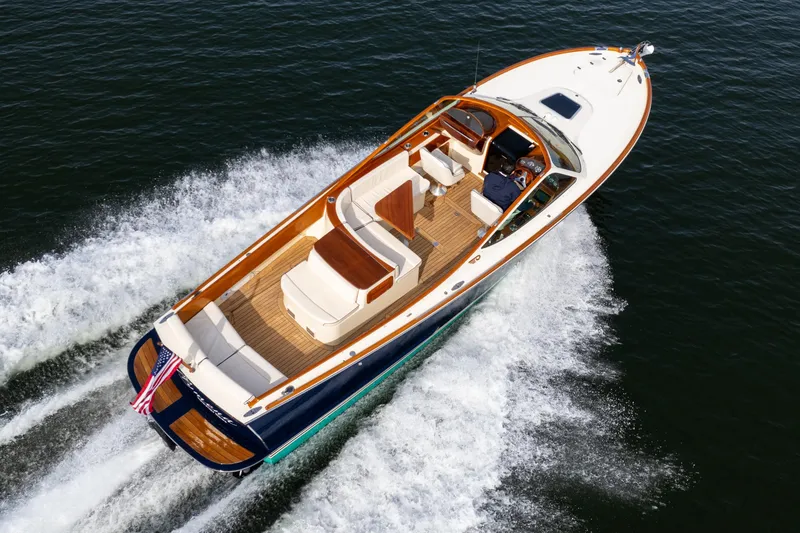 Slide: The Image of 2006 Hinckley Talaria 29 R yacht cruising on open water, aerial view. - 6