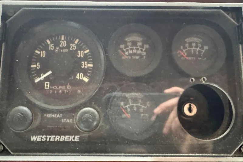 Slide: The Image of Close-up of 1987 Custom Cedar Craft dashboard with Westerbeke gauges and dials. - 20