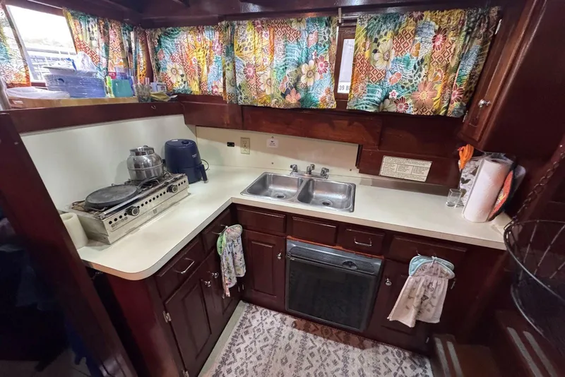 Slide: The Image of Cozy 1987 Cedar Craft kitchen with vintage decor and colorful curtains. - 24