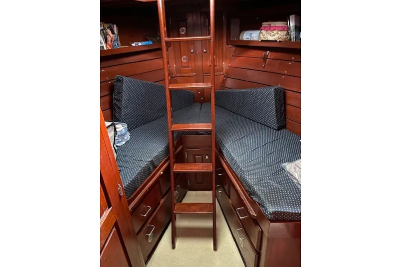 Slide: The Image of 1987 Custom Cedar Craft cabin interior with wooden bunk beds and ladder. - 30