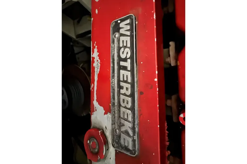 Slide: The Image of Red Westerbeke engine detail on 1987 Custom Cedar Craft. - 36