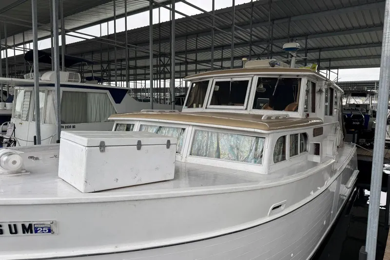 Slide: The Image of 1987 Custom Cedar Craft boat docked in a covered marina. - 5