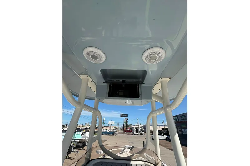 Slide: The Image of 2023 Skeeter SX2550 Family boat interior with speakers and electronics console. - 10