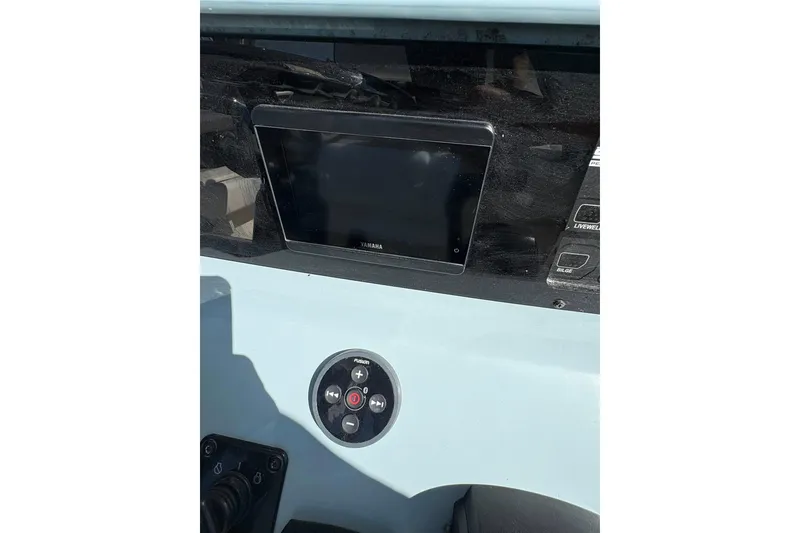Slide: The Image of 2023 Skeeter SX2550 Family boat dashboard with Yamaha display and control panel. - 13