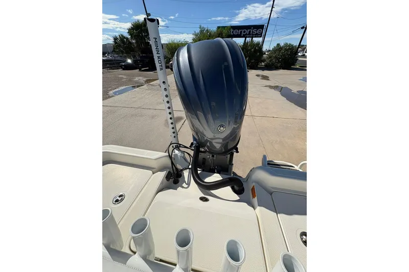Slide: The Image of 2023 Skeeter SX2550 Family boat with outboard motor and Minn Kota accessory. - 14