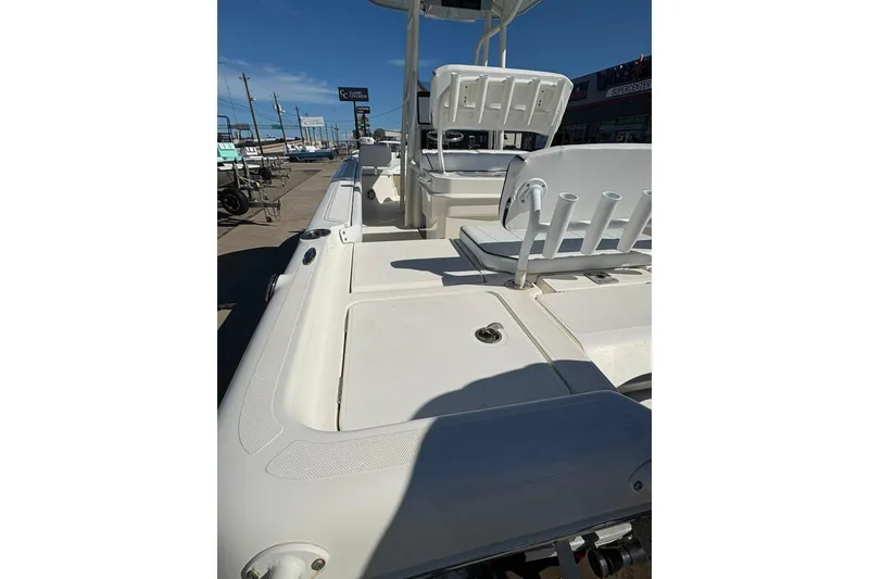 Slide: The Image of 2023 Skeeter SX2550 Family boat deck with seating and storage compartments. - 20