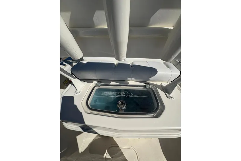 Slide: The Image of 2023 Skeeter SX2550 Family boat interior with storage compartment and cushioned seating. - 8