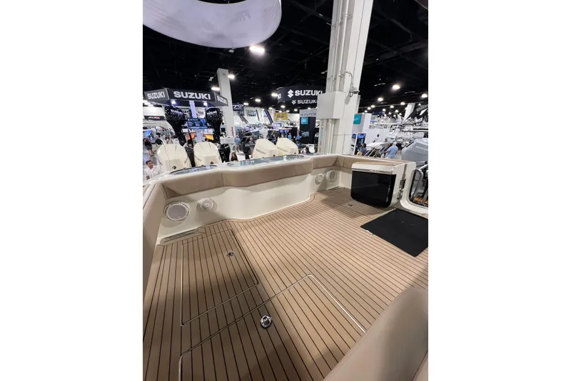 Slide: The Image of 2026 Front Runner 43 HTX Catamaran interior at a boat show, featuring teak flooring. - 10