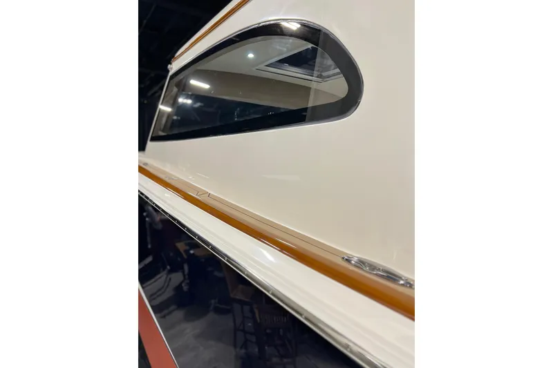 Slide: The Image of Close-up of 2026 Front Runner 43 HTX Catamaran window and sleek exterior design. - 13
