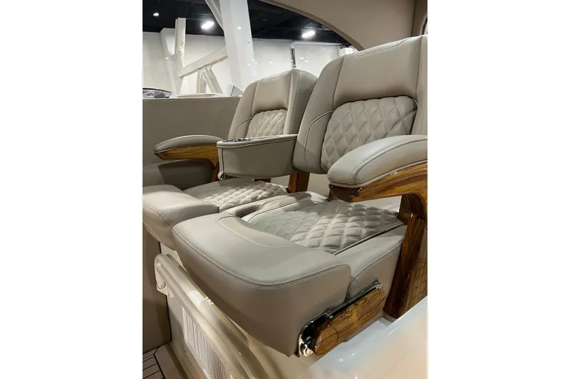 Slide: The Image of Luxurious seating on 2026 Front Runner 43 HTX Catamaran, featuring quilted leather and wooden accents. - 19