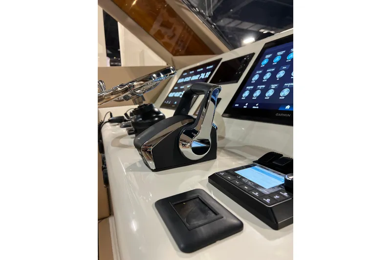 Slide: The Image of Control panel of 2026 Front Runner 43 HTX Catamaran with modern navigation displays. - 8