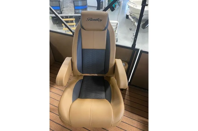 Slide: The Image of Luxurious seating in 2026 Bentley Pontoons Elite 253 Swingback boat, featuring tan and black upholstery. - 17